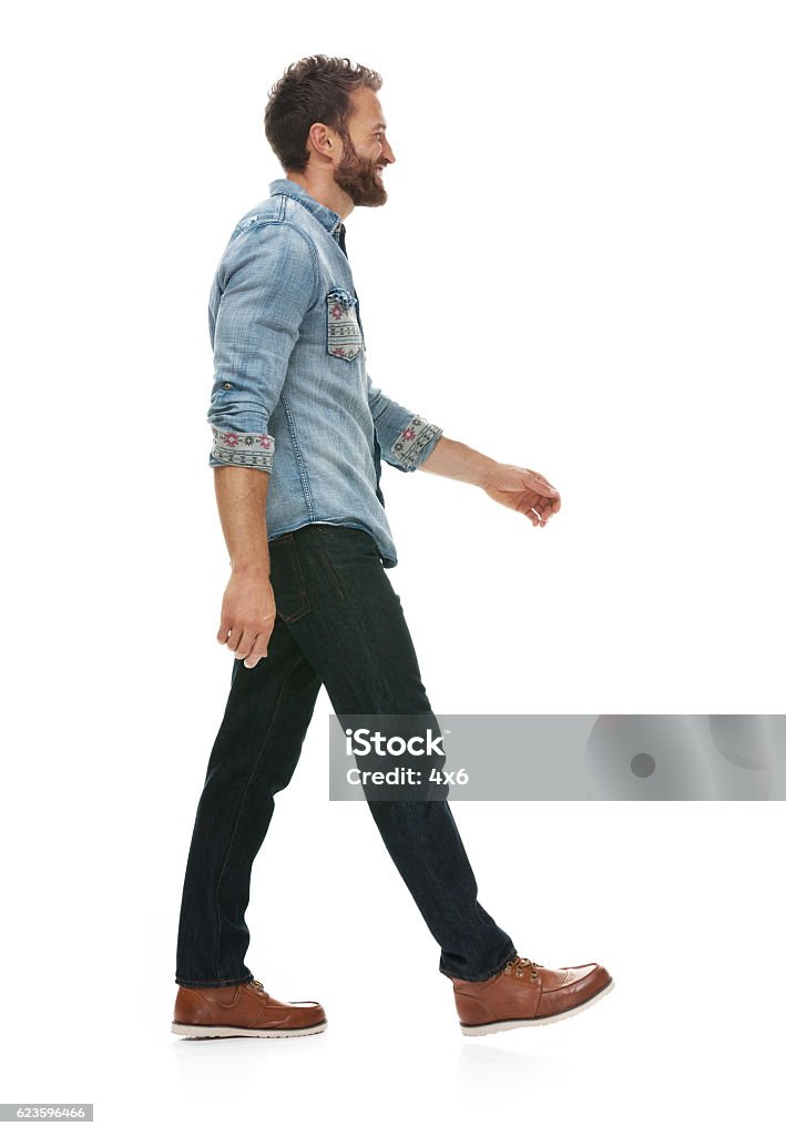 Smiling casual man walking Walking Stock Photo