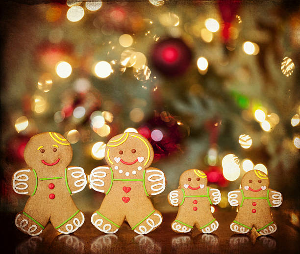 istock Gingerbread Man in front of Christmas Tree with Textured Background 623597036