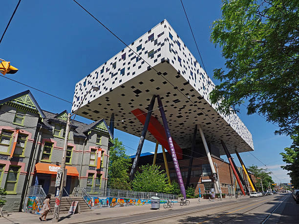 Art college on stilts Toronto, Canada - June 3, 2016:  The Ontario College of Art and Design has an unusual addition on stilts above an older building. ocad stock pictures, royalty-free photos & images
