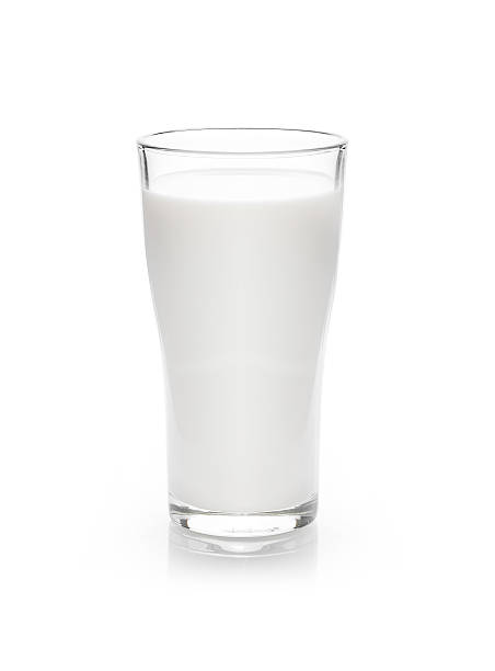 istock milk in the glass on white background 623597736
