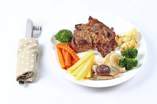 istock Home made ,Pork steak and mixed vegetables served. 623598188