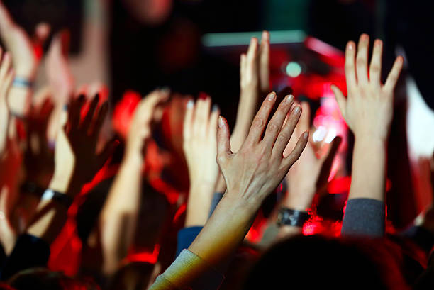 istock raised up a human hands at the event 623599368