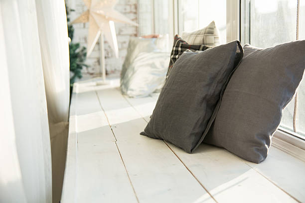 istock Brown cushions on a wooden window sill 623599848
