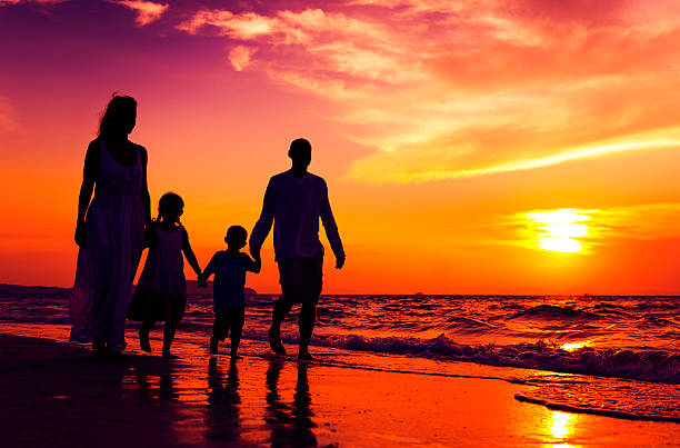 istock Family walking on the beach happiness Concept 623599952
