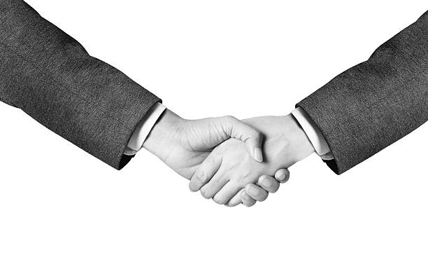 istock black and white business man hand shake 623601452