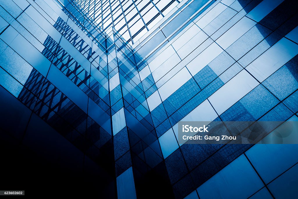 Perspective view of contemporary glass building skyscraper Perspective and underside angle view of contemporary glass building skyscraper,blue toned,china. Abstract Stock Photo