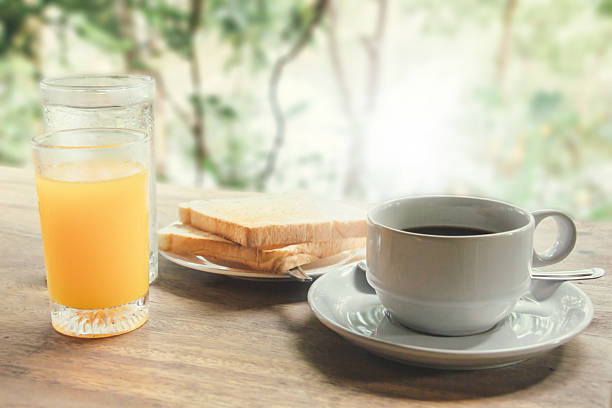 istock cup of coffee with breakfast set background 623602612