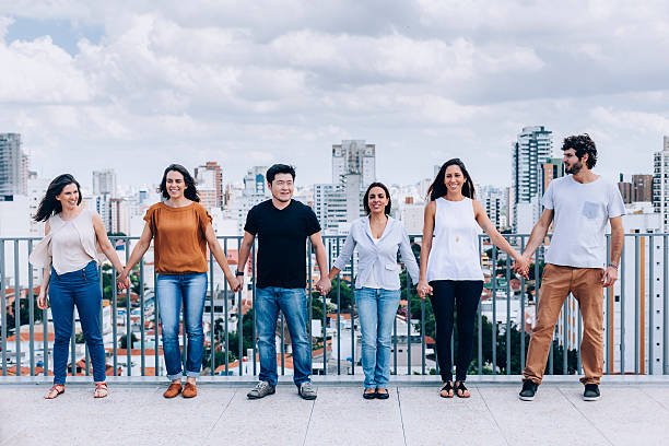 istock Group of friends holding hands 623603022