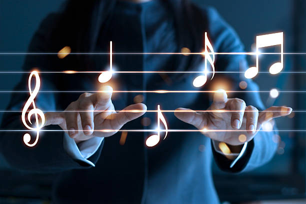 Woman hands playing music notes on dark background, music concept Woman hands playing music notes on dark background, music concept musical note photos stock pictures, royalty-free photos & images