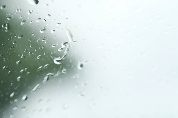 istock drops of water on the transparent glass background, Copy space 623605044