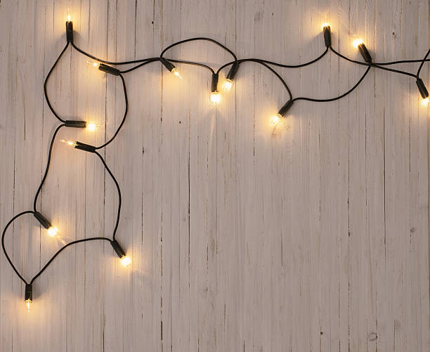 istock christmas lights on  wooden background 623605362