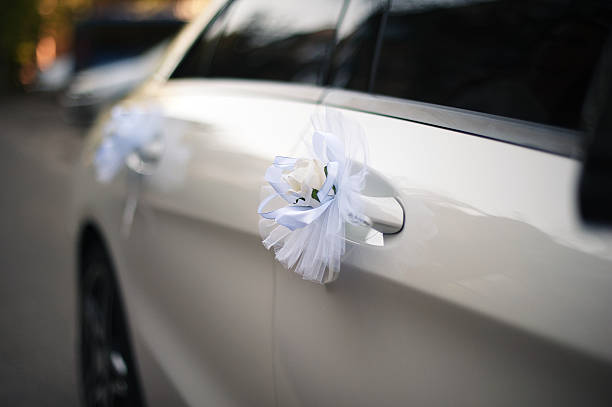 istock Flowers and decorations at the white wedding car 623607204