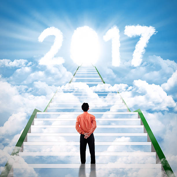 istock Entrepreneur standing on the staircase with number 2017 623607332