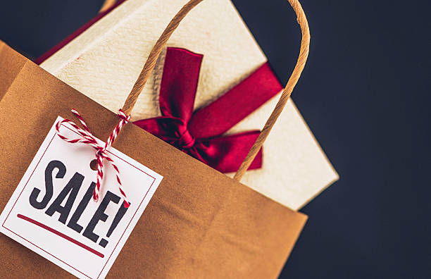 istock Sale shopping bag with gifts and message 623607618