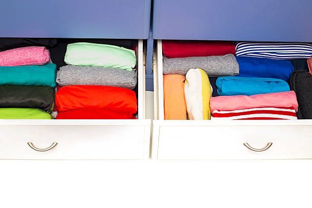 istock Clothing lying in the drawer in the wardrobe. 623607982
