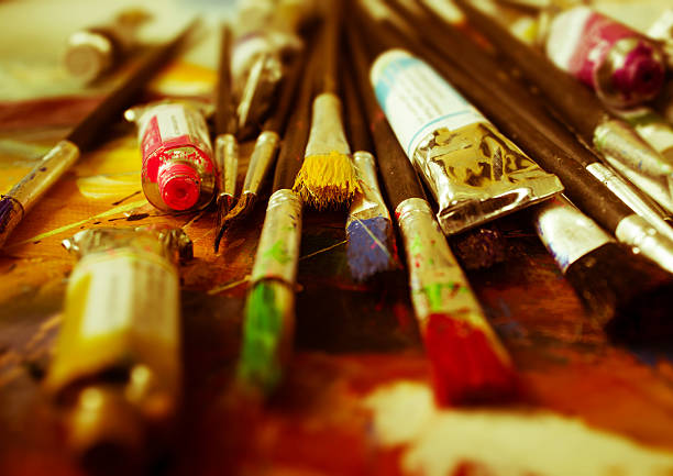 istock Artist paint brush on painting background 623608240