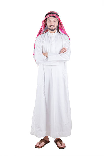 istock Arabic person smiling and standing in studio 623608334