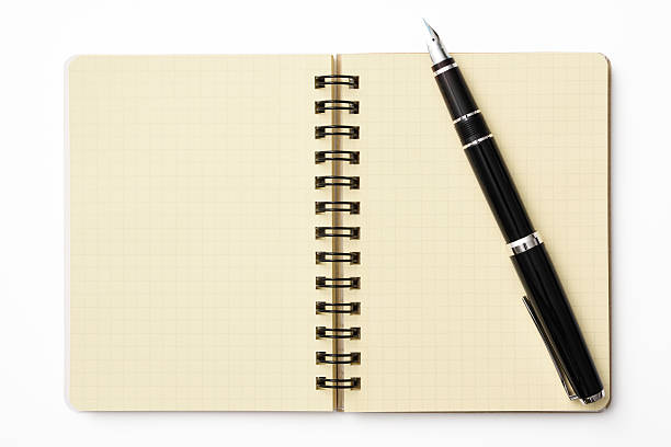 istock Opened spiral notebook with fountain pen on white background 623608336