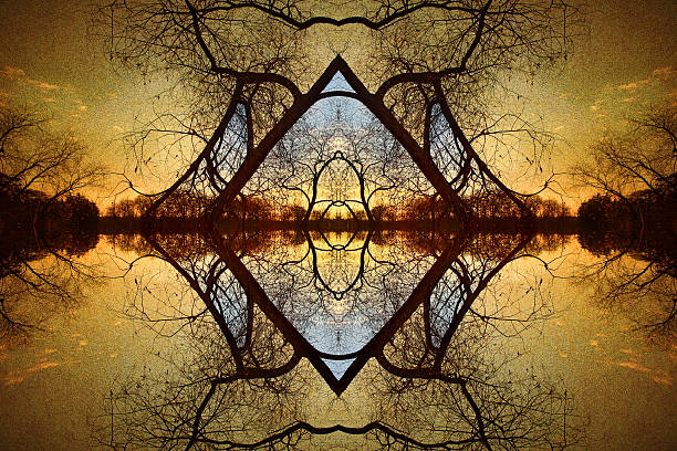 A late autumn sunset on a Minnesota lake seen through a frame of tree branches. 