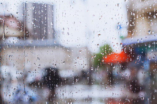 window glass in rainy day, background, street of Paris
