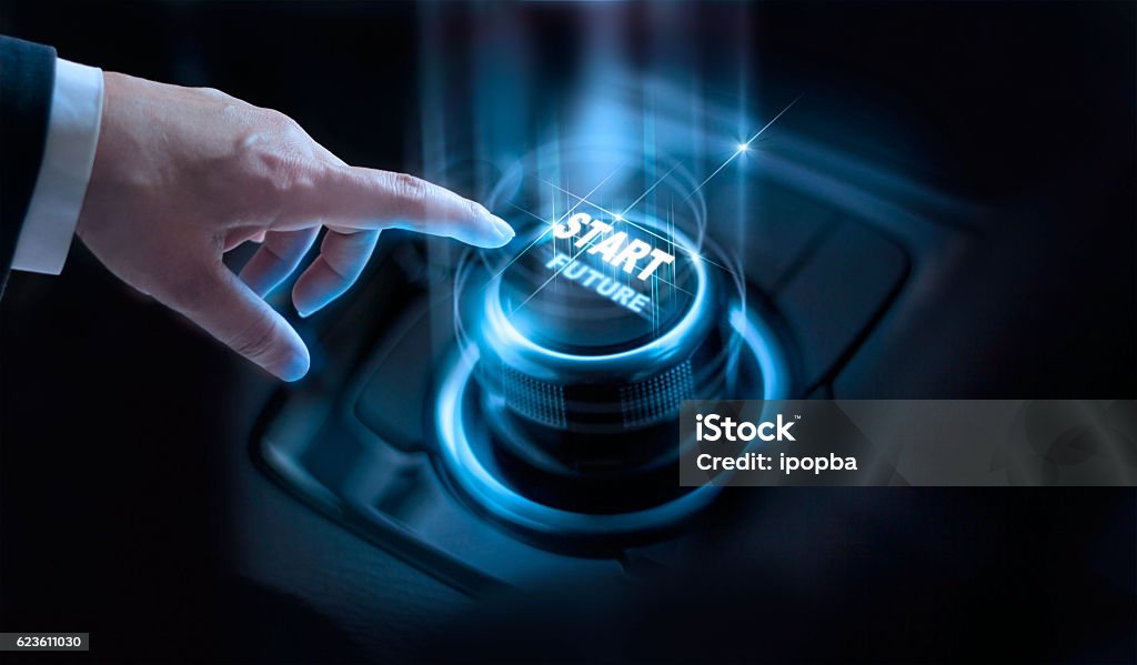 Businessman press start future button with virtual light dark background Businessman press start future button with virtual light in dark background Anticipation Stock Photo