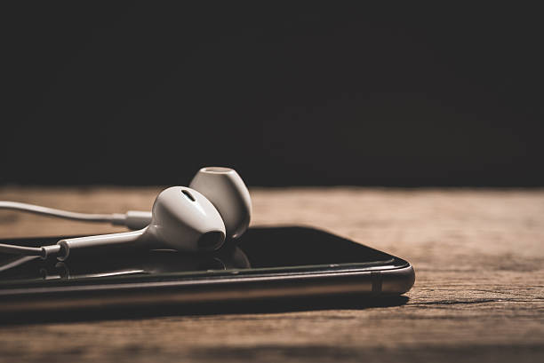 istock Headphone and phone media portable on dark tone. 623615052