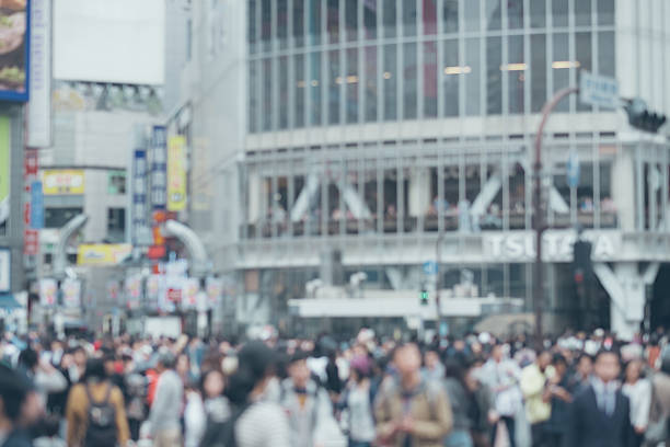 istock Blurred Shibuya crossing pedestrians walk in rush hour 623615872