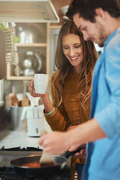 istock She loves watching him cook 623616806