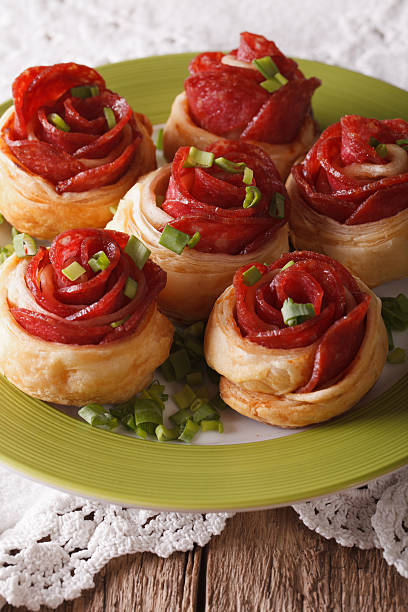 Beautiful food: roll with salami and cheese close-up. Vertical