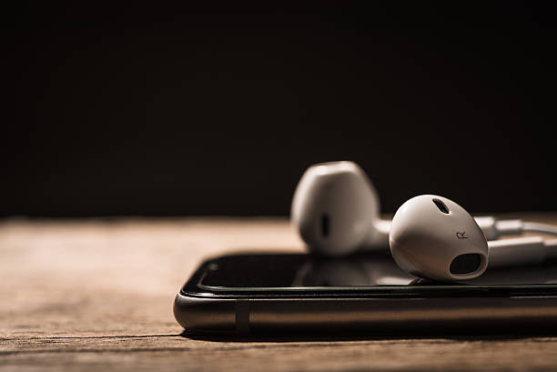 istock Headphone and phone media portable on dark tone. 623619906