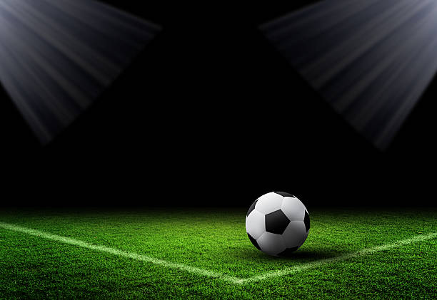 istock Soccer Ball and Grass on dark background 623620032