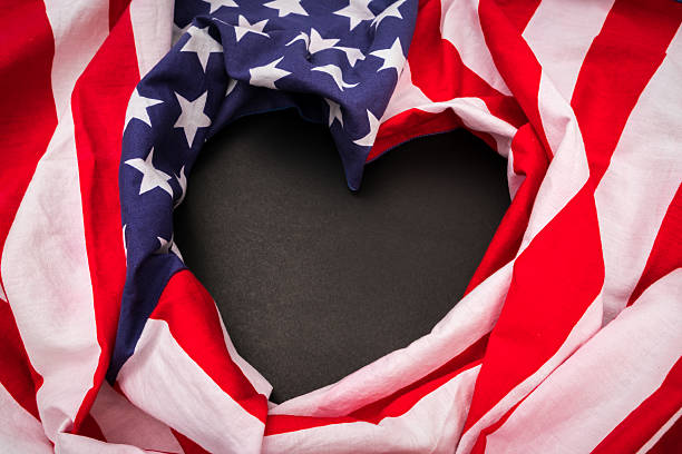 Heart shape American flag on black background