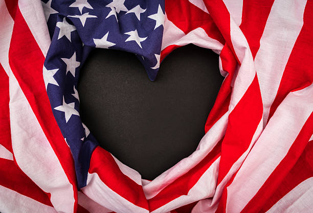 istock Heart shape American flag on black background 623621150