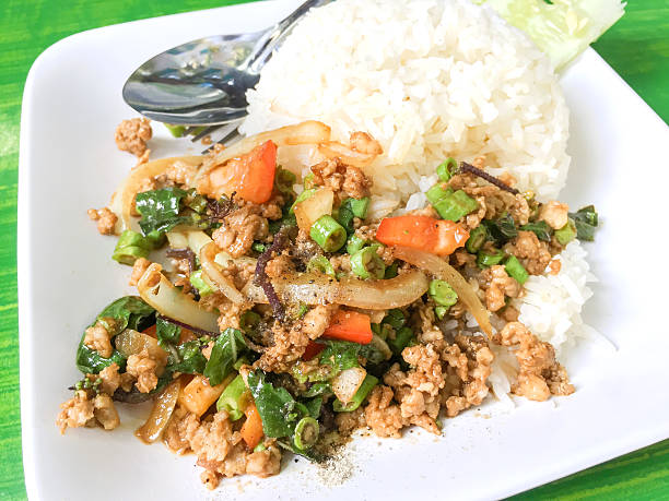 istock Thai food , stir-fried pork and basil served with rice 623622206