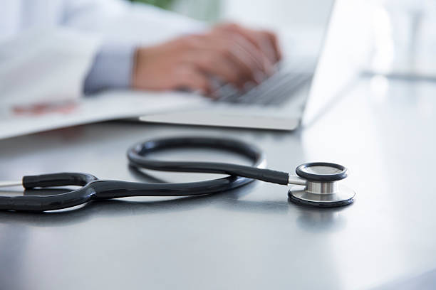 istock Doctor using laptop at hospital 623623178