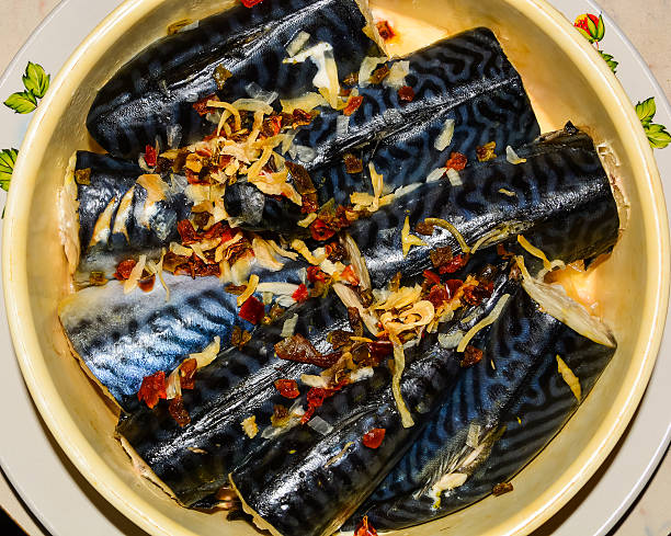 istock Fresh mackerel and spices for cooking closeup 623623934