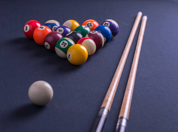 istock Blue billiard table with balls and cues. 623667010