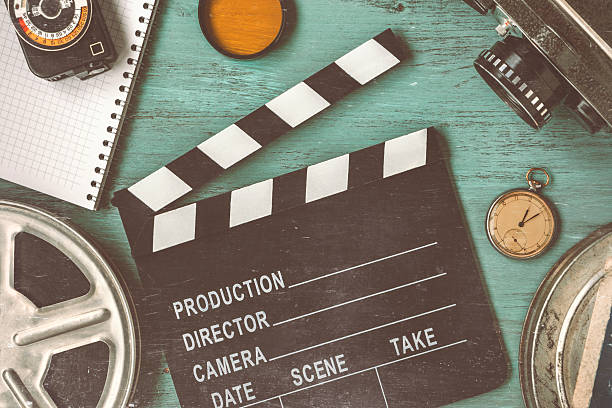 istock Clapperboard and a film reel 623668062