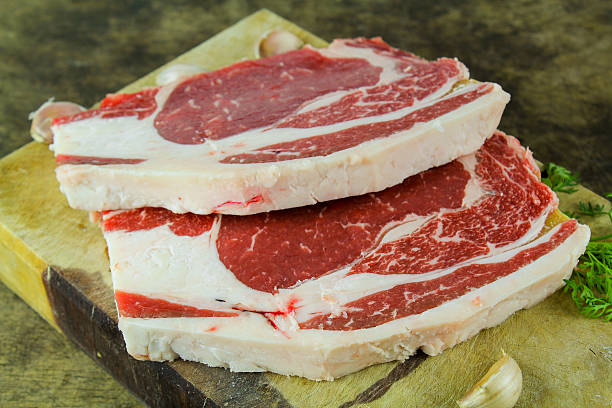 istock Slide rib eye beef preparation for cooking 623673766