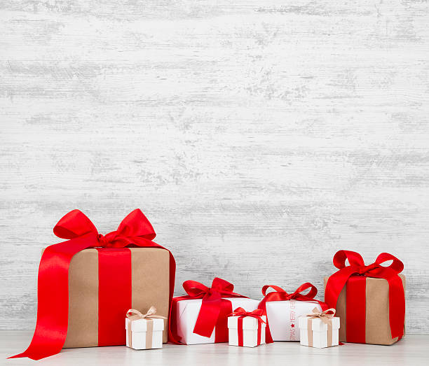 istock Christmas Gift Boxes on Wghite Grunge Wooden Background 623674740
