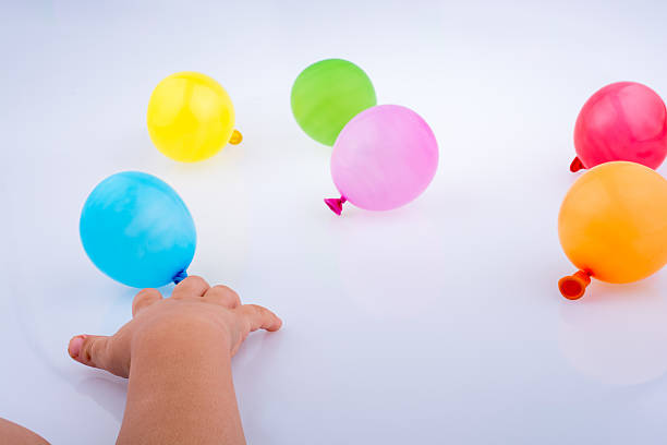 istock Hand holding Colorful Balloons 623676500