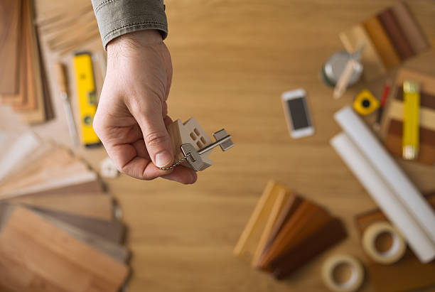 istock Real estate agent giving house keys 623677004
