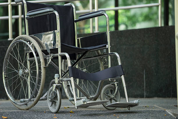 istock Empty wheelchair parked in hospital 623679850