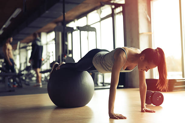 istock Beautiful woman training in gym 623680734