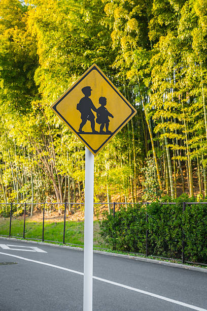 istock Children crossing road sign 623681112