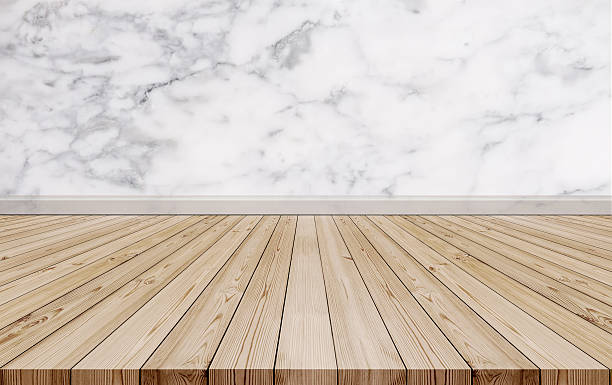 istock Natural oak wood floor with luxury marble stone wall texture 623681460