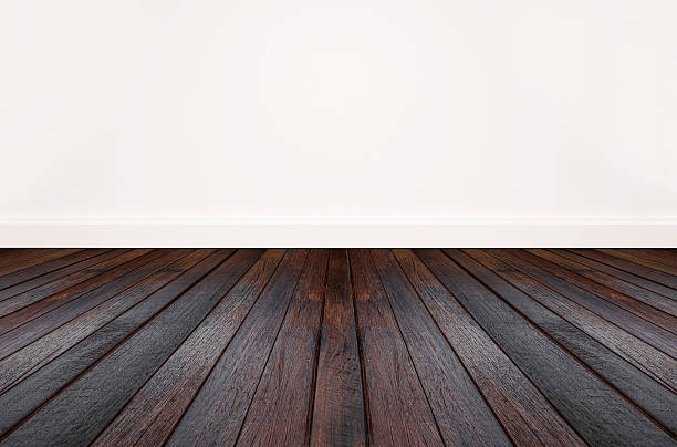 istock hardwood floor and white wall 623681892