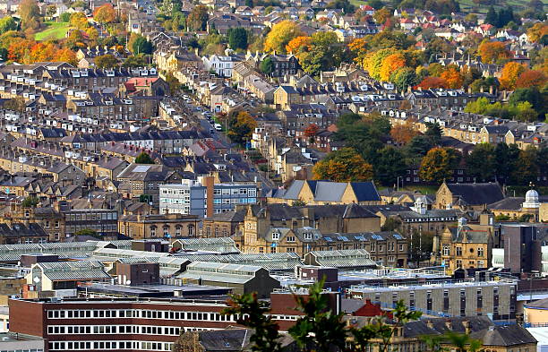 View of town, Aire Valley in Keighley, West Yorkshire Photo showing the view across the Aire Valley, in the hilly Pennines, near Keighley and Bradford, taken in Keighley on an October afternoon. Photo shows the terraced housing and parklands, also the buildings in the centre of the small town on a sunny day. Taken with a Canon EOS 1200D digital SLR Camera. pennines photos stock pictures, royalty-free photos & images
