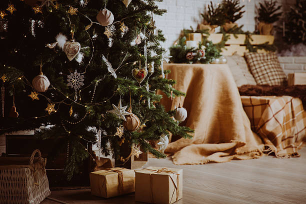 istock Christmas tree and presents in decorated living room 623687292
