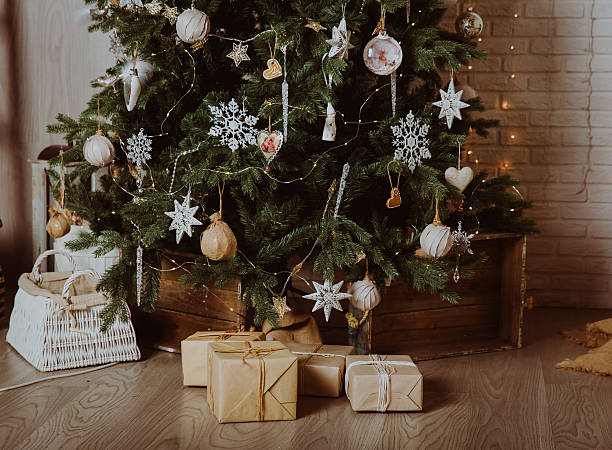 istock Christmas tree and presents in decorated living room 623687478